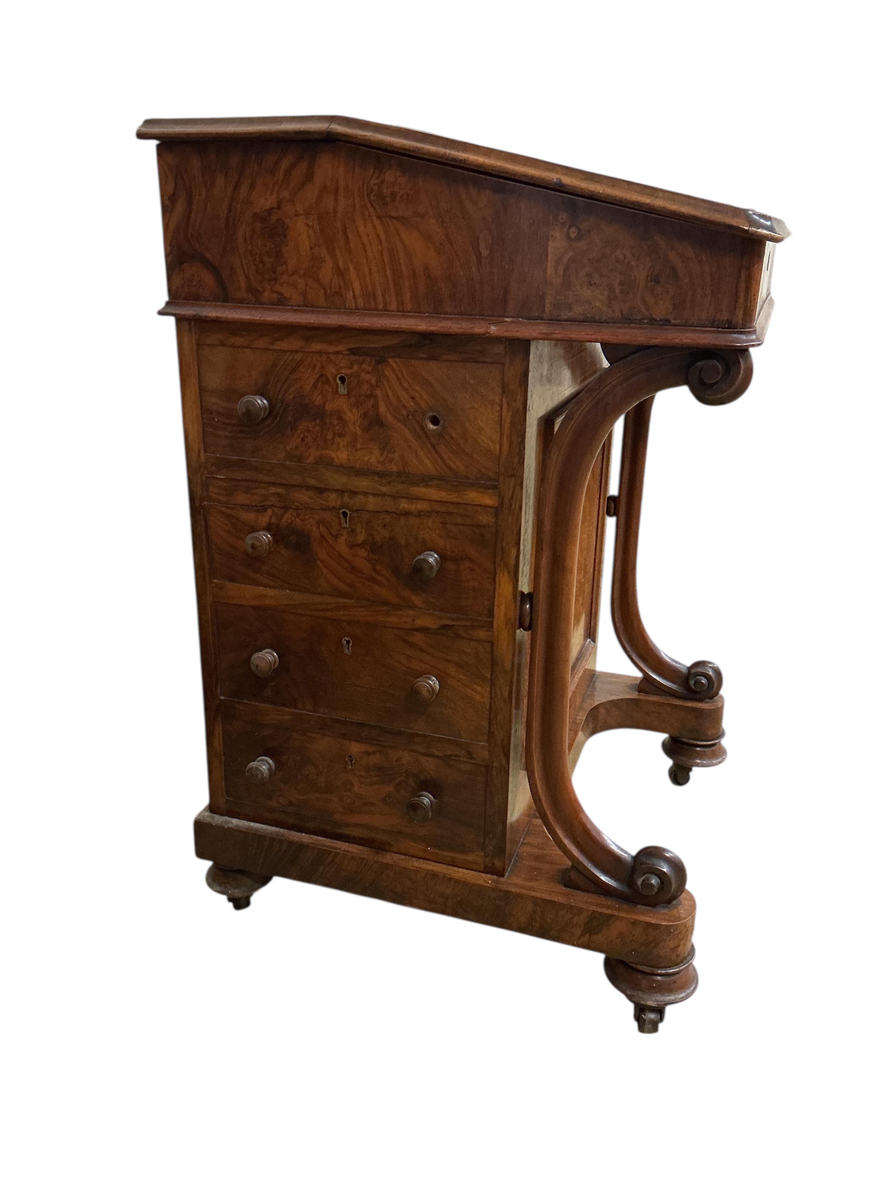 A Victorian figured walnut Davenport, lacks superstructure, width 53cm, depth 53cm, height 81cm